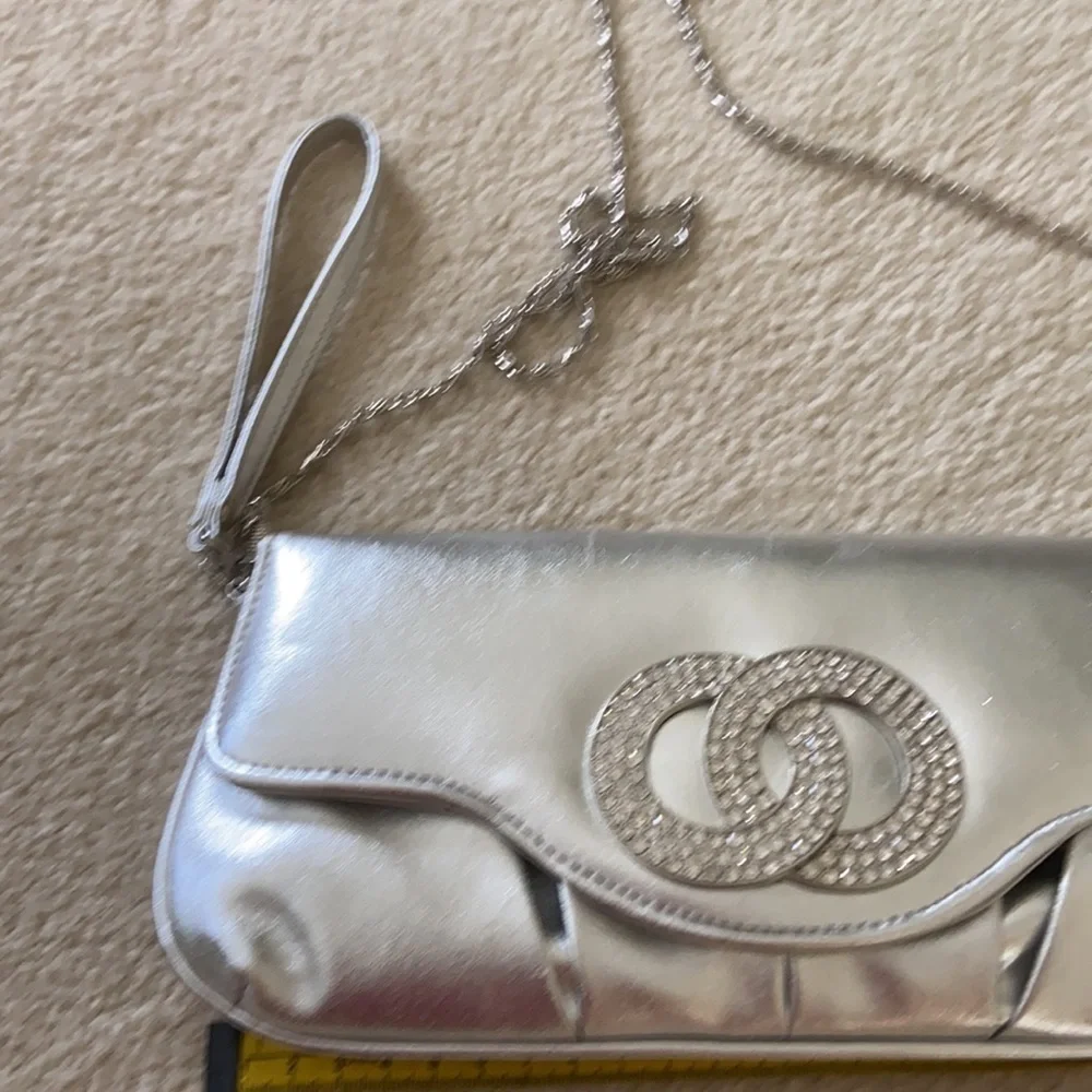 Silver clutch with removable chain and wrist strap